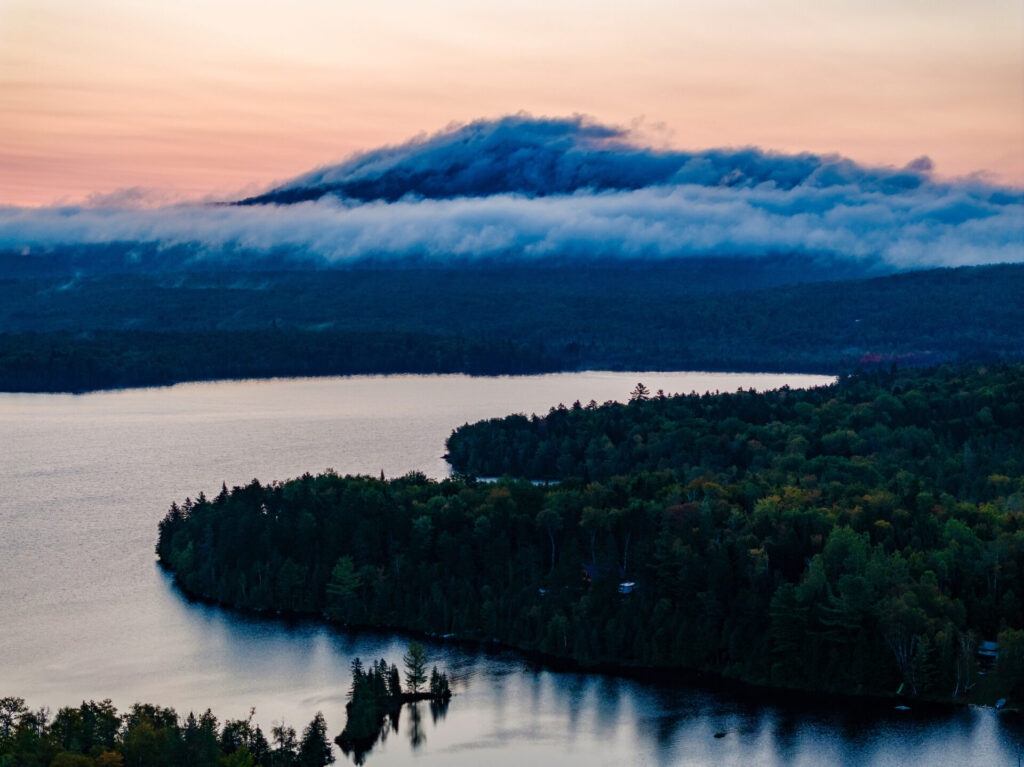 Dawn clouds over Mount Chase as seen from above Lower Shin Pond in Patten, Maine.